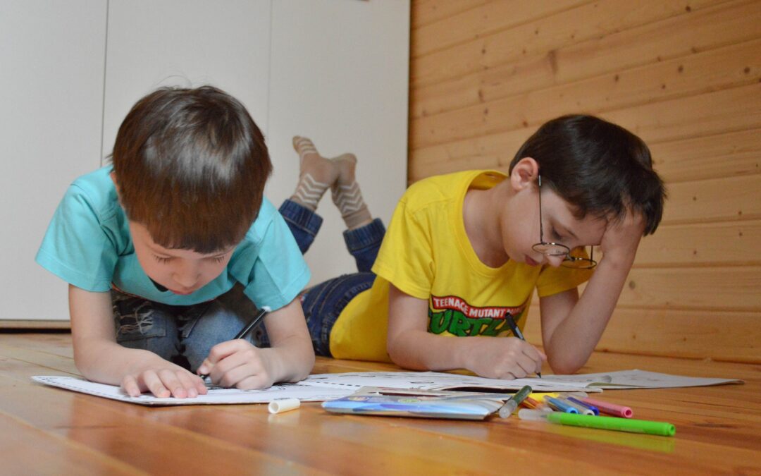 two boys coloring